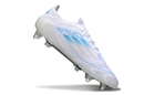 ADIDAS F50 + SG ELITE 2025 TRAVA MISTA
