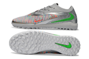 CHUTEIRA SOCIETY NIKE PHANTOM REACTX 6 PRO TF CINZA/PRATA/VERDE (PRONTA ENTREGA)